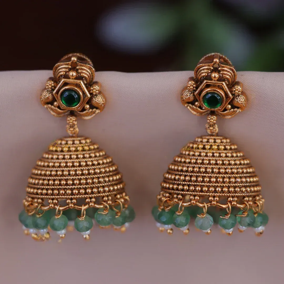 Gold Jhumka Earrings with Glorious Green Stones